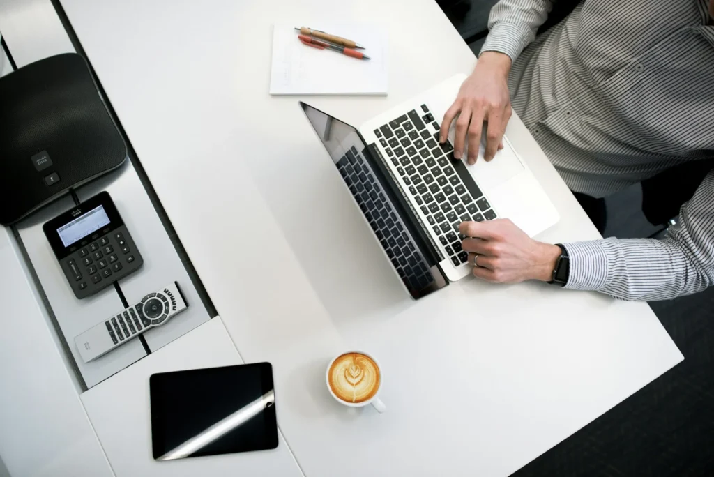 Person using macbook in office